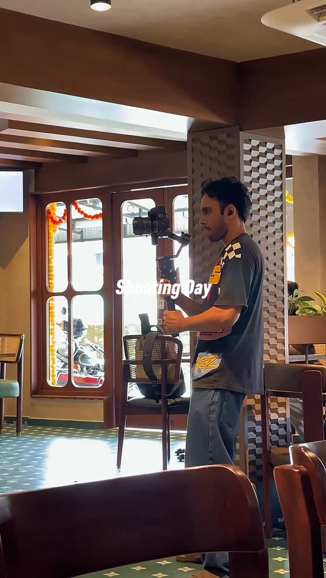 Aqla camera operator filming on location